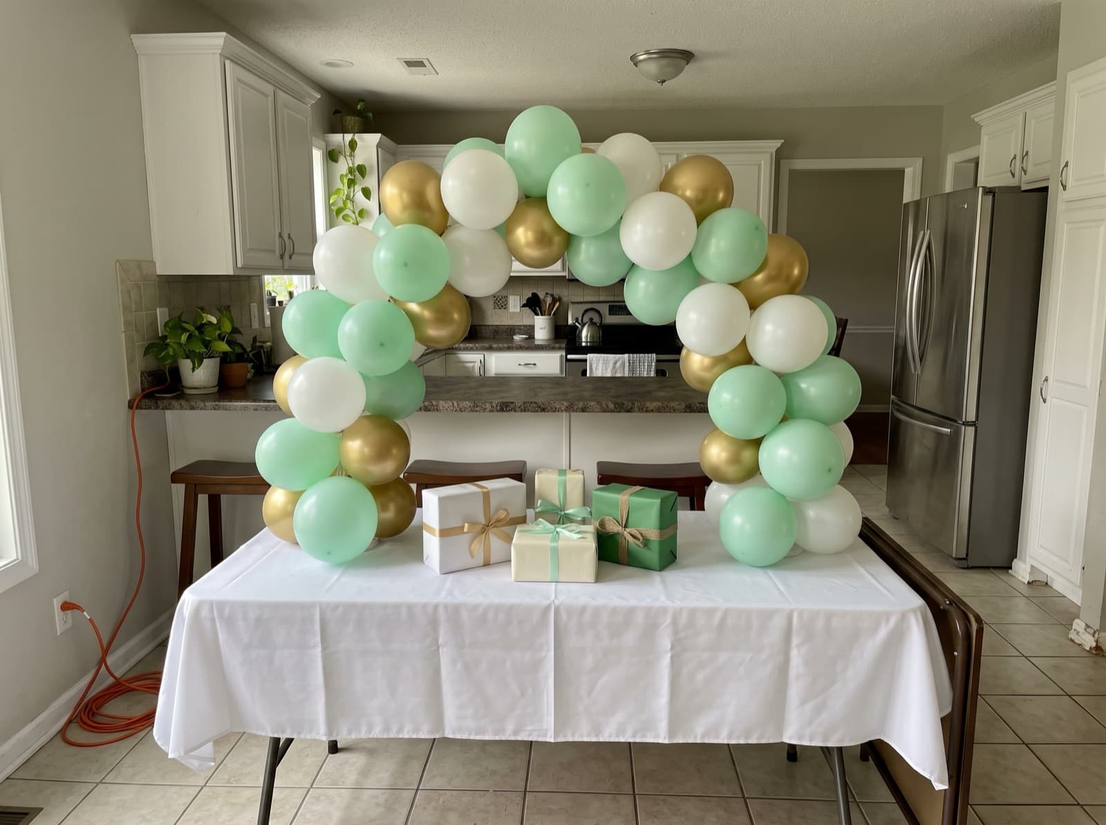 Mini tabletop balloon arch over a gift table